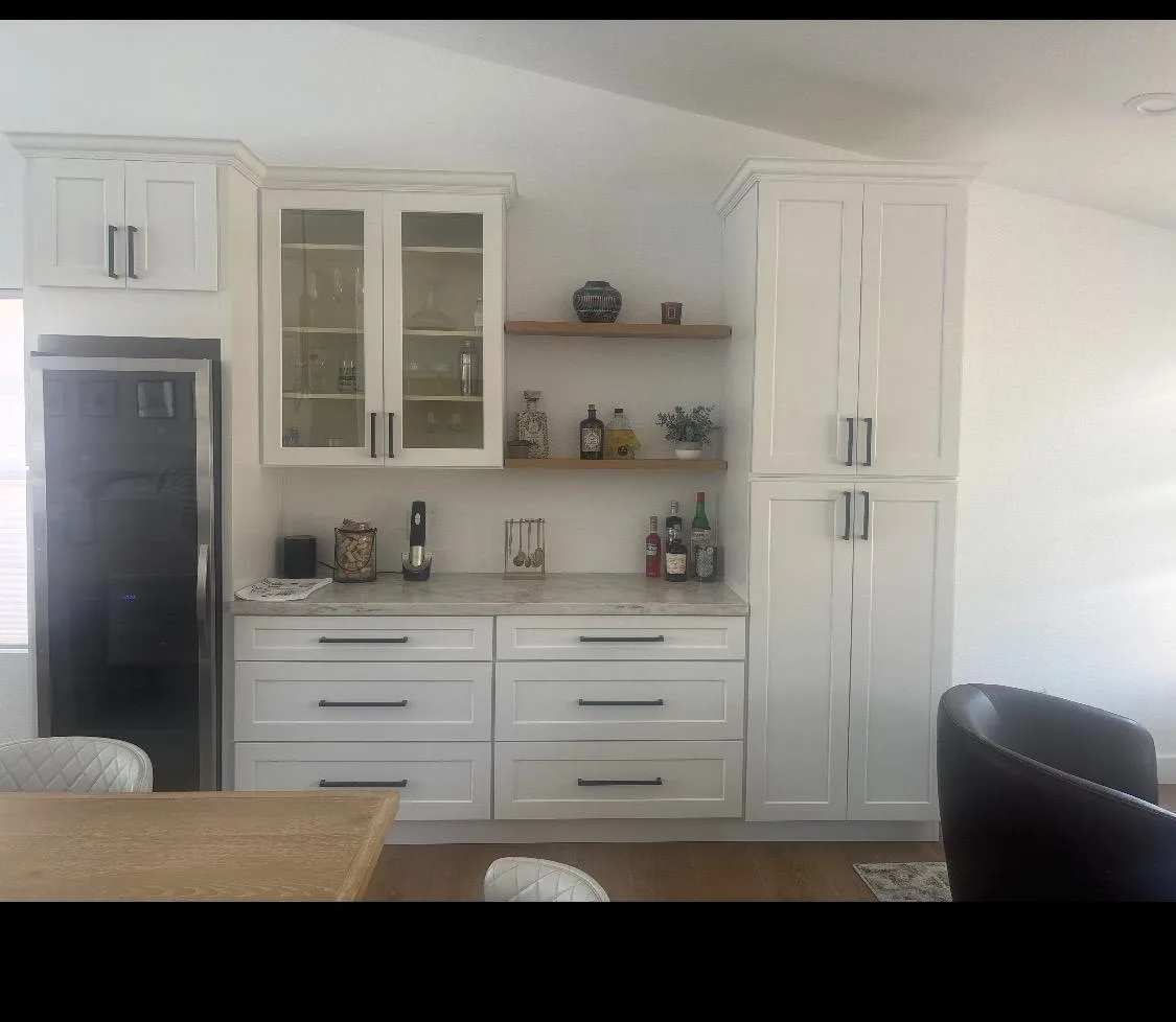 Custom-built entertainment center with a wine fridge and quartz counter