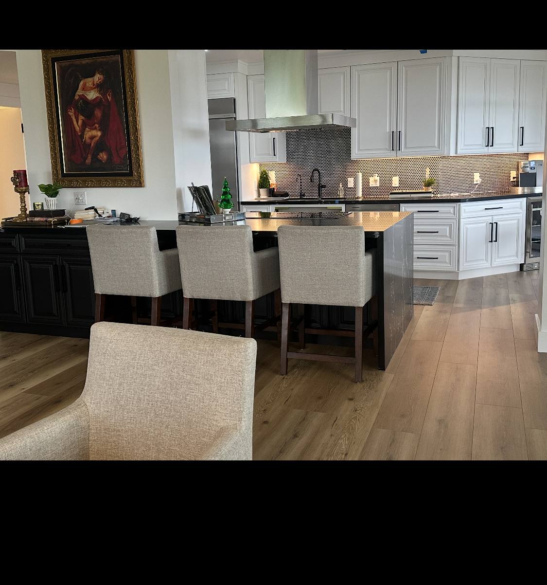 Wood-look tile flooring running through a remodeled kitchen